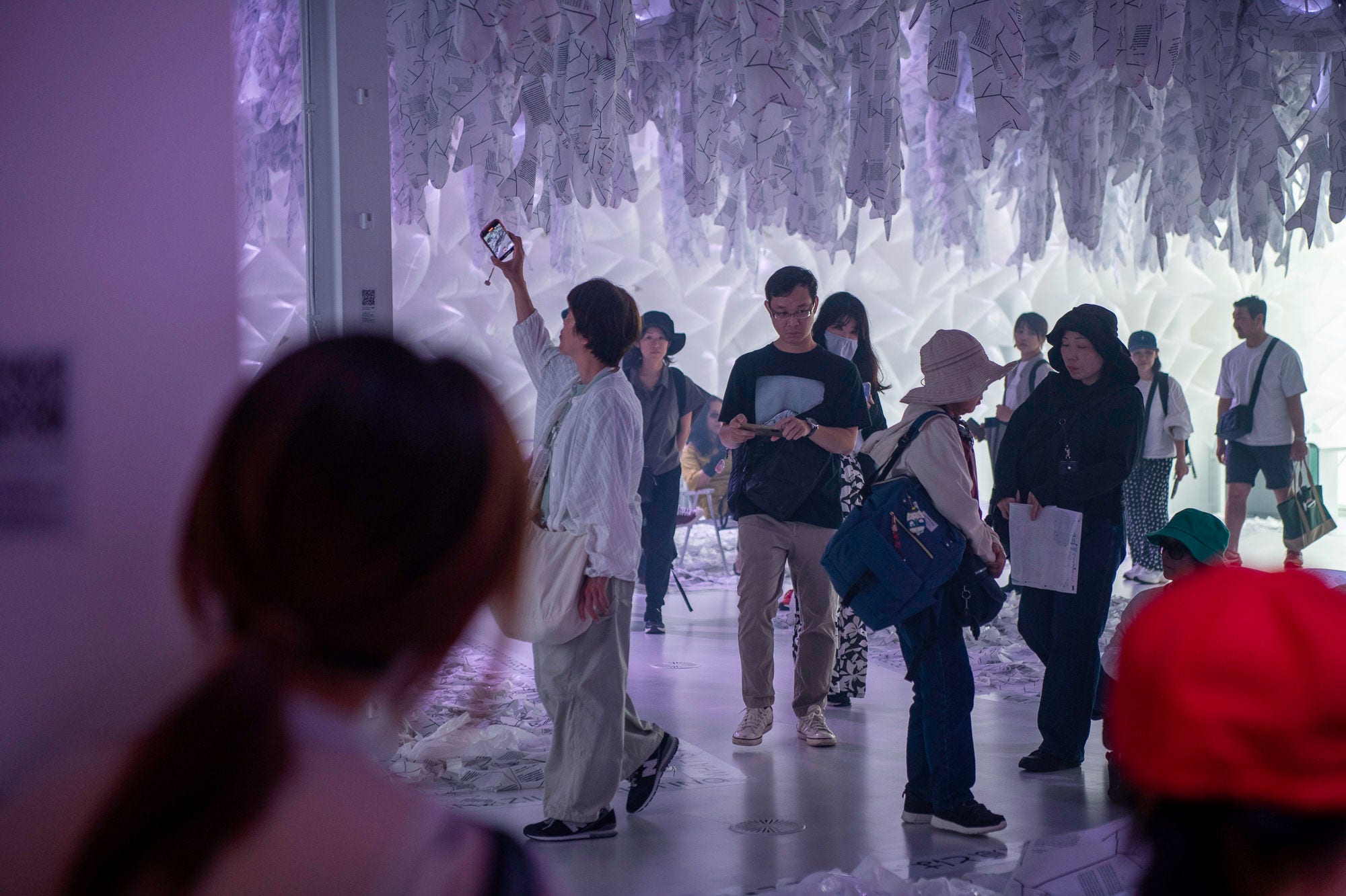 Visitors walk in the main hall